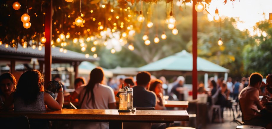 An outdoor bar and restaurant with people.